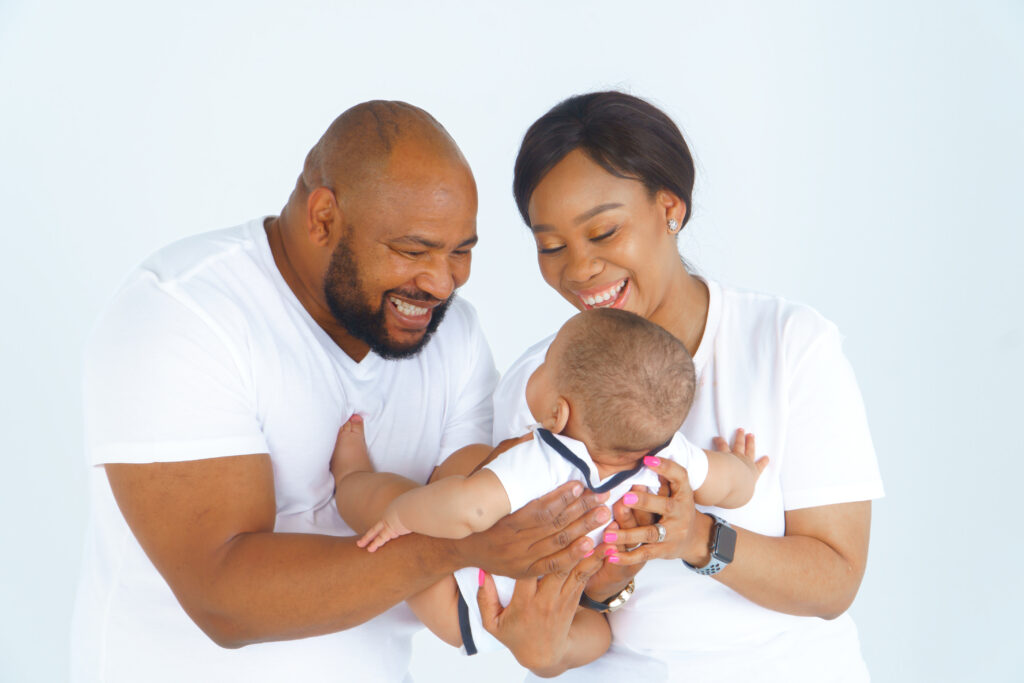 Parents holding their baby during a family session