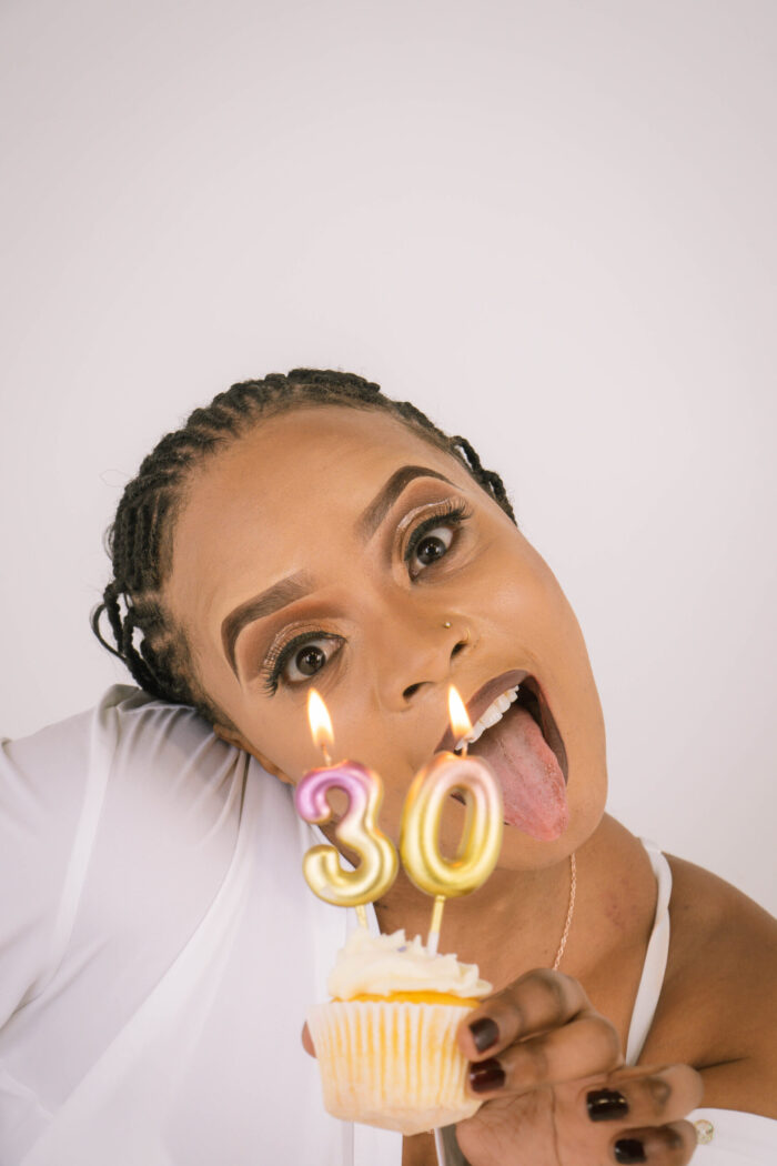 Birthday portrait with a cupcake and a number 30 candle