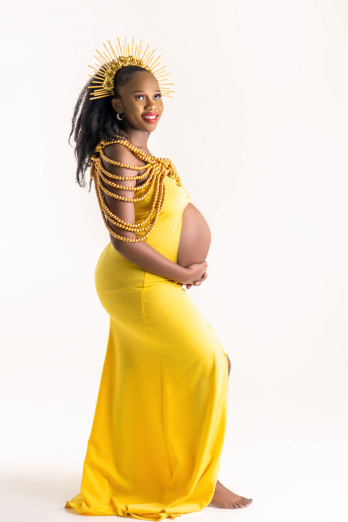 Maternity portrait in a yellow gown