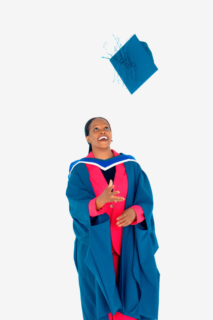 Graduate throwing her cap in the air