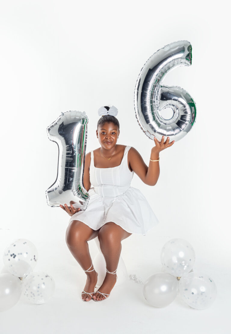 Sweet 16 birthday portrait with silver number balloons