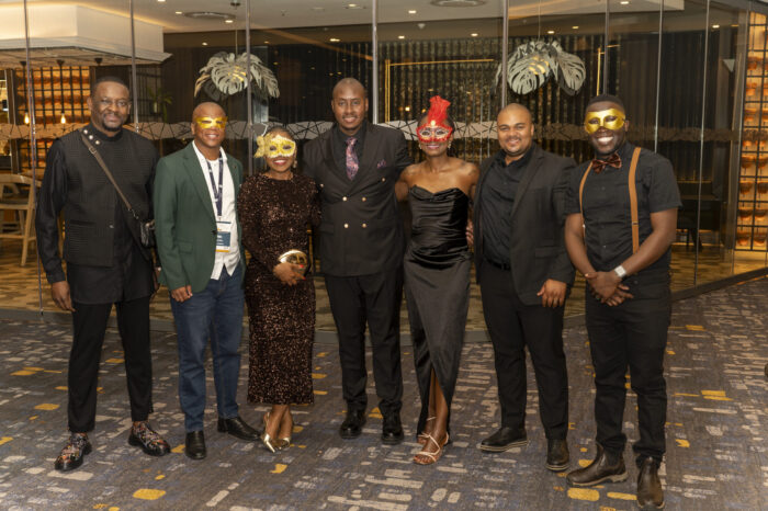 Guests in formal wear at a gala dinner