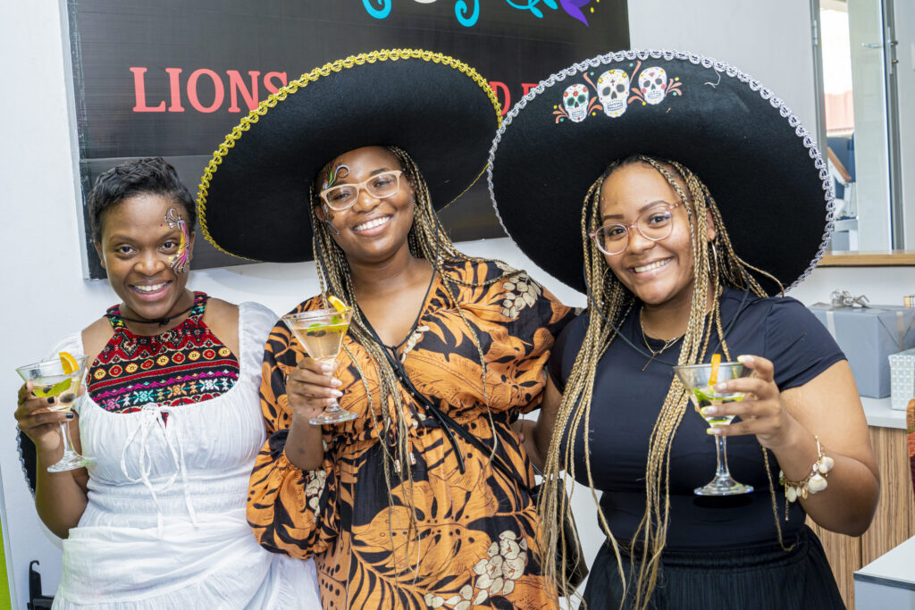 Friends posing together at a themed celebration