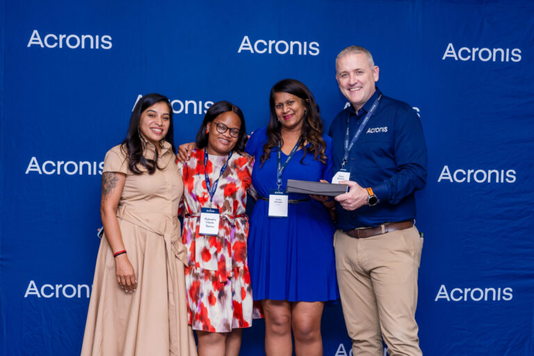 Award winners photographed at the Acronis backdrop