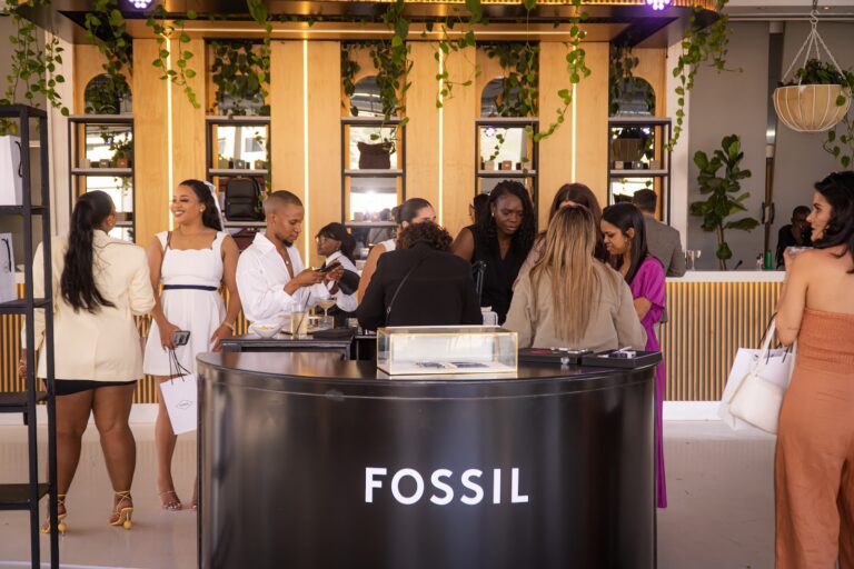 Guests gathered around the Fossil branded counter at the brand activation
