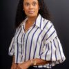 Professional headshot, striped blouse on a dark backdrop, by Studio24.7