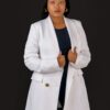 Professional headshot, white blazer on a black backdrop, by Studio24.7
