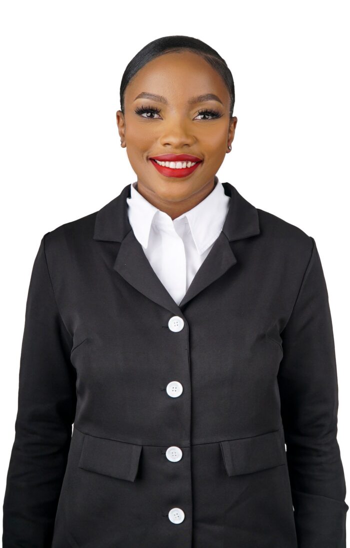 Professional headshot, black jacket with white collar on a white backdrop, by Studio24.7
