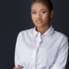 Professional headshot, white shirt on a dark backdrop, by Studio24.7