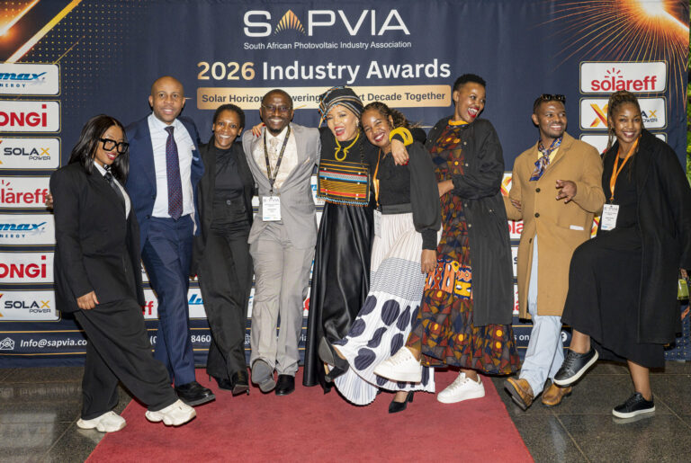 Guests posing as a group on the red carpet at the SAPVIA Industry Awards